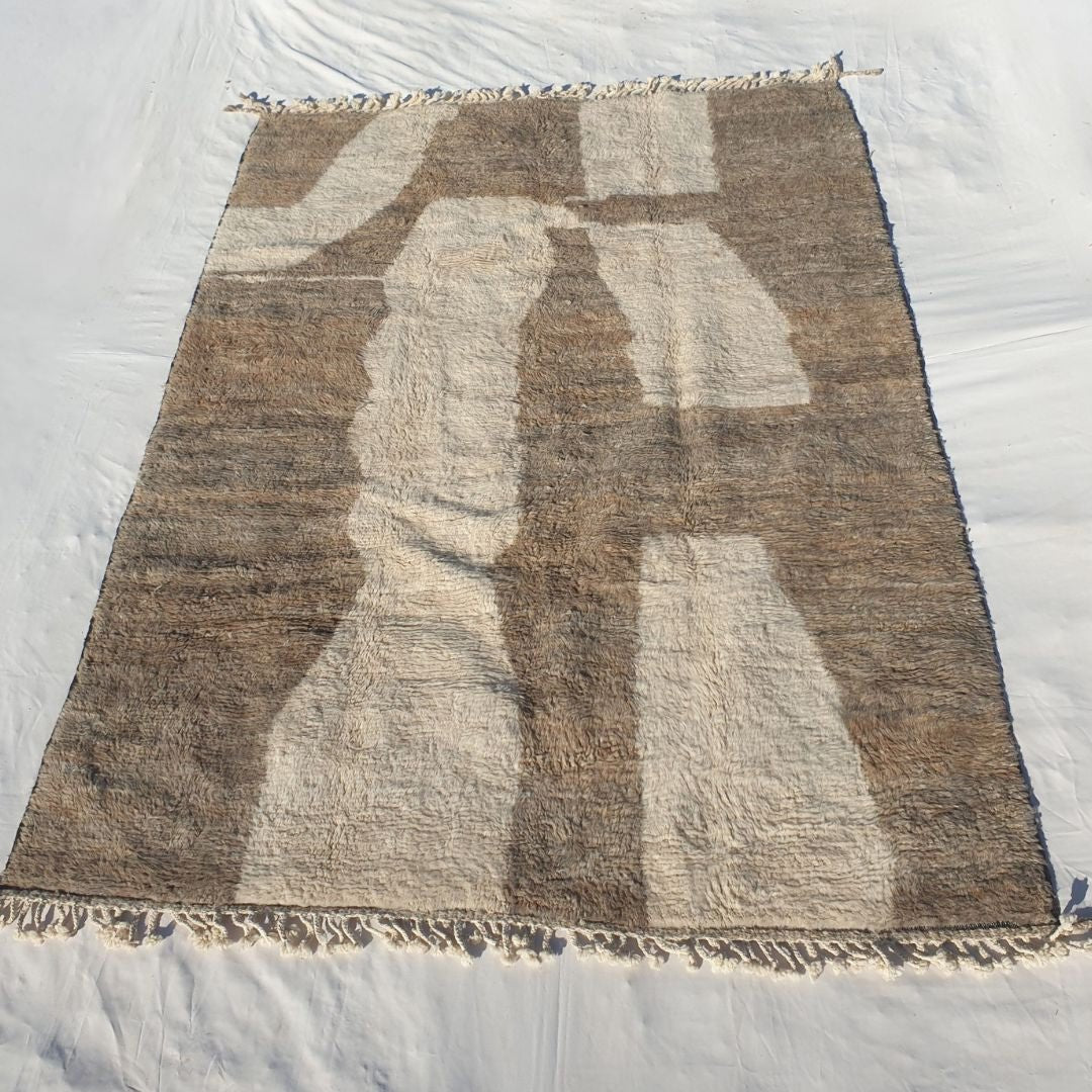 Dense plush pile and earthy brown-ivory patchwork effect in this sumptuous Beni Ourain Berber carpet