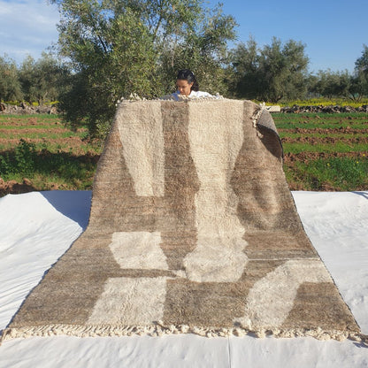 Soft 7x10 Beni Ourain Moroccan rug in ivory with brown geometric block panels and ultra thick plush pile held outdoors