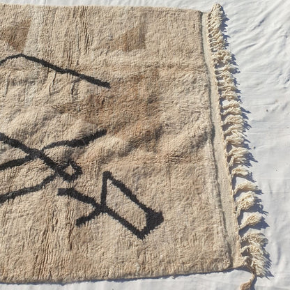 Striking black abstract diamond lines and X-shape crossing on ivory field of authentic Beni Ourain Moroccan wool rug