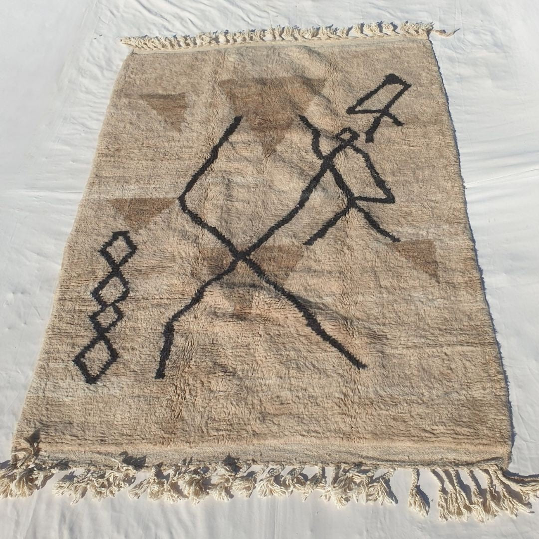 Dense plush pile and classic black motifs in this sumptuous Beni Ourain Berber carpet