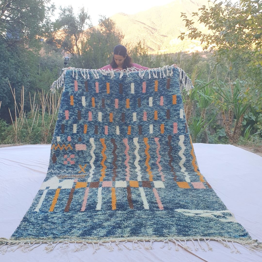 Vibrant blue abstract Beni Ourain shag rug 6x10 ft with pink orange ivory motifs – handwoven Moroccan wool berber carpet