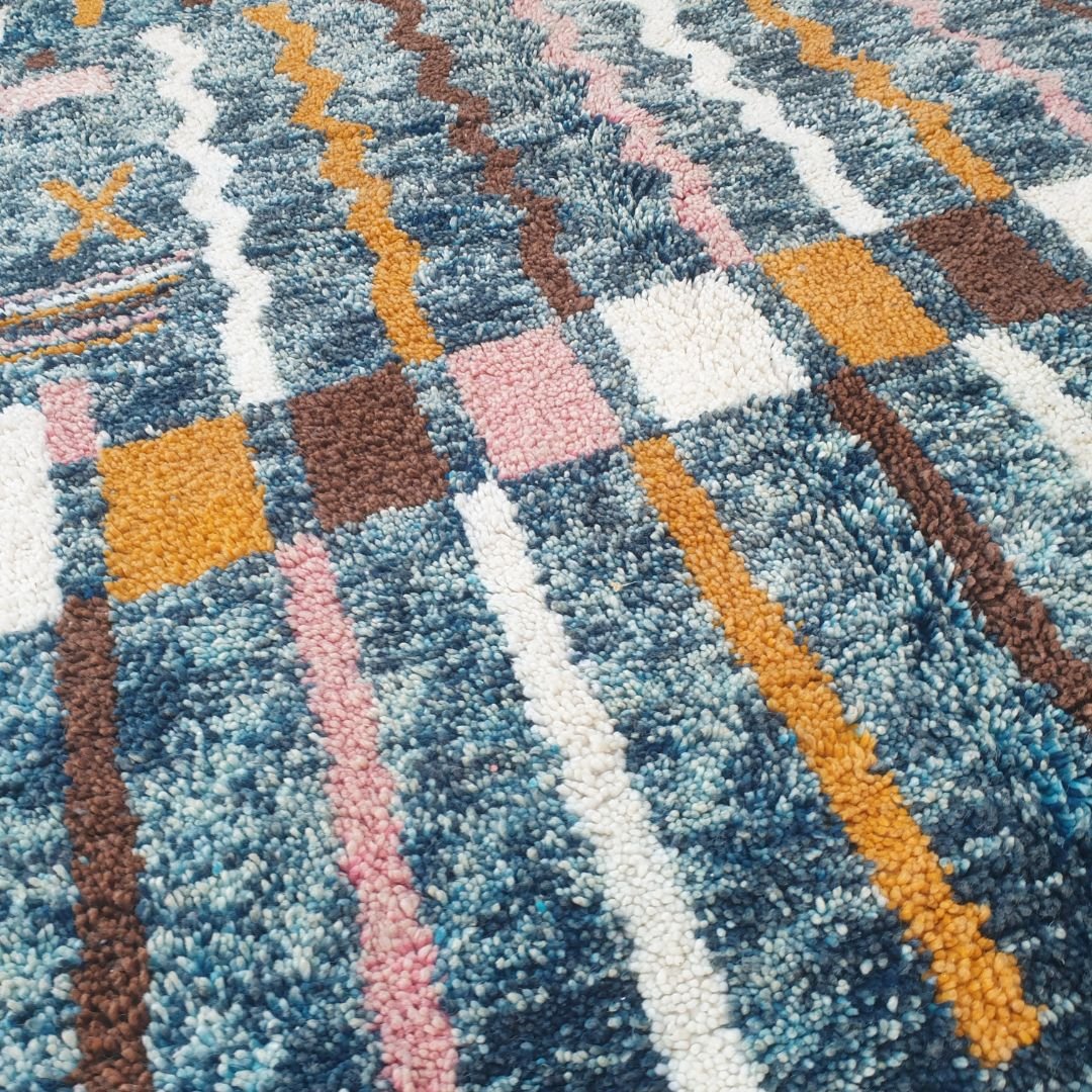 Fluffy high-pile texture on colorful abstract blue Beni Ourain Moroccan shag rug, playful wool details