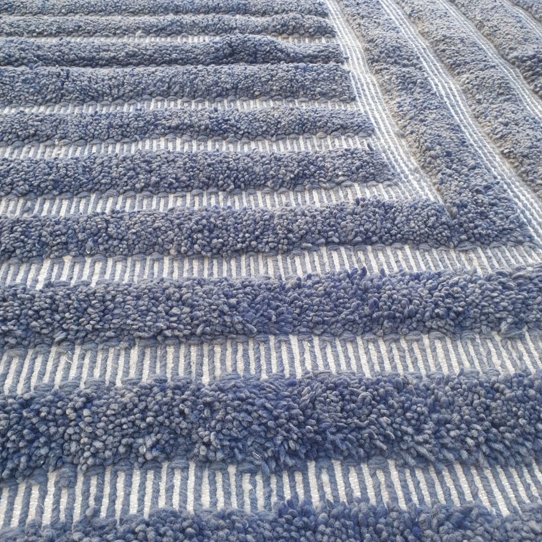 Luxurious fluffy pile on navy blue striped Beni Ourain Moroccan shag rug, soft natural wool texture