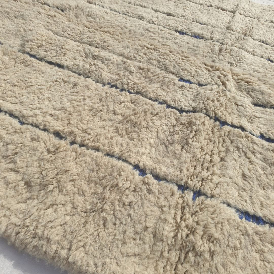 Ifawa - Beni Ourain Rug with Tonal Beige Field and Rare Blue Line Accents - Handwoven Berber Carpet | 6'6"x10'5" Ft | 198x317 cm - OunizZ