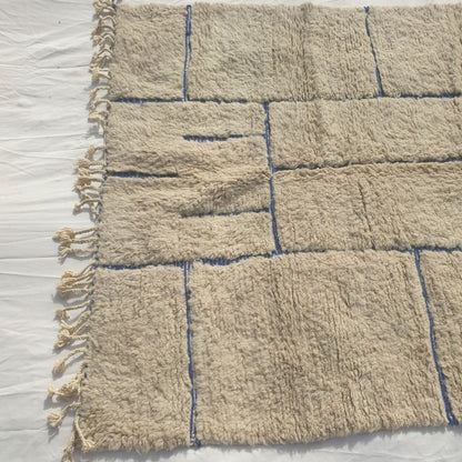 Ifawa - Beni Ourain Rug with Tonal Beige Field and Rare Blue Line Accents - Handwoven Berber Carpet | 6'6"x10'5" Ft | 198x317 cm - OunizZ