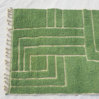 Bold green maze/labyrinth paths forming geometric design on plush field of authentic Beni Ourain Moroccan wool rug