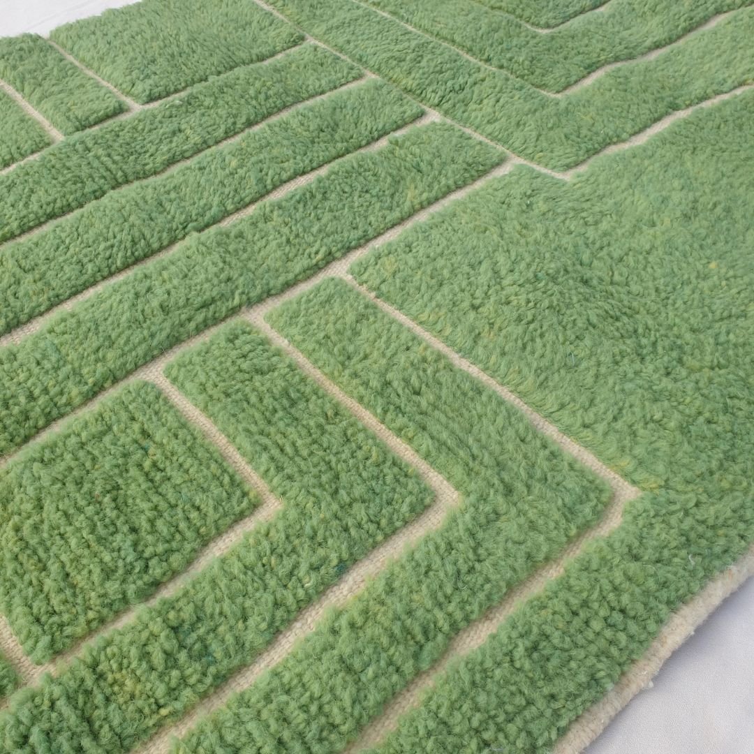 Ultra fluffy thick high-pile wool texture detail of vibrant green Beni Ourain plush shag rug