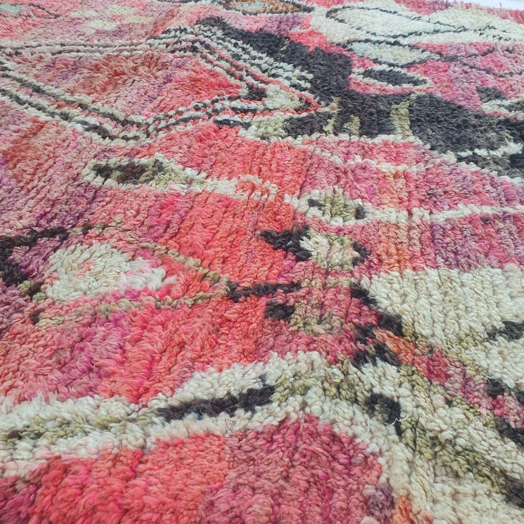 Intense pink diamond motifs with black outlines on vibrant Boujad Moroccan rug, natural wool texture
