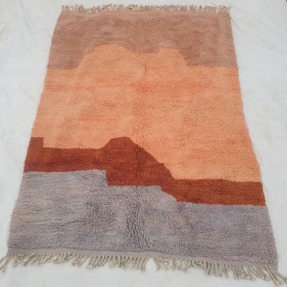Fringe edge and serene sunset horizon layers on fluffy custom Moroccan shag carpet highlighting super soft wool and artistic gradient