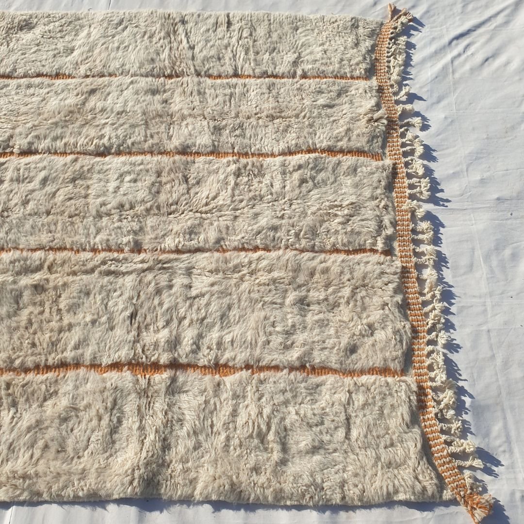 Warm orange terracotta vertical lines on pure ivory field of authentic Beni Ourain Moroccan wool rug