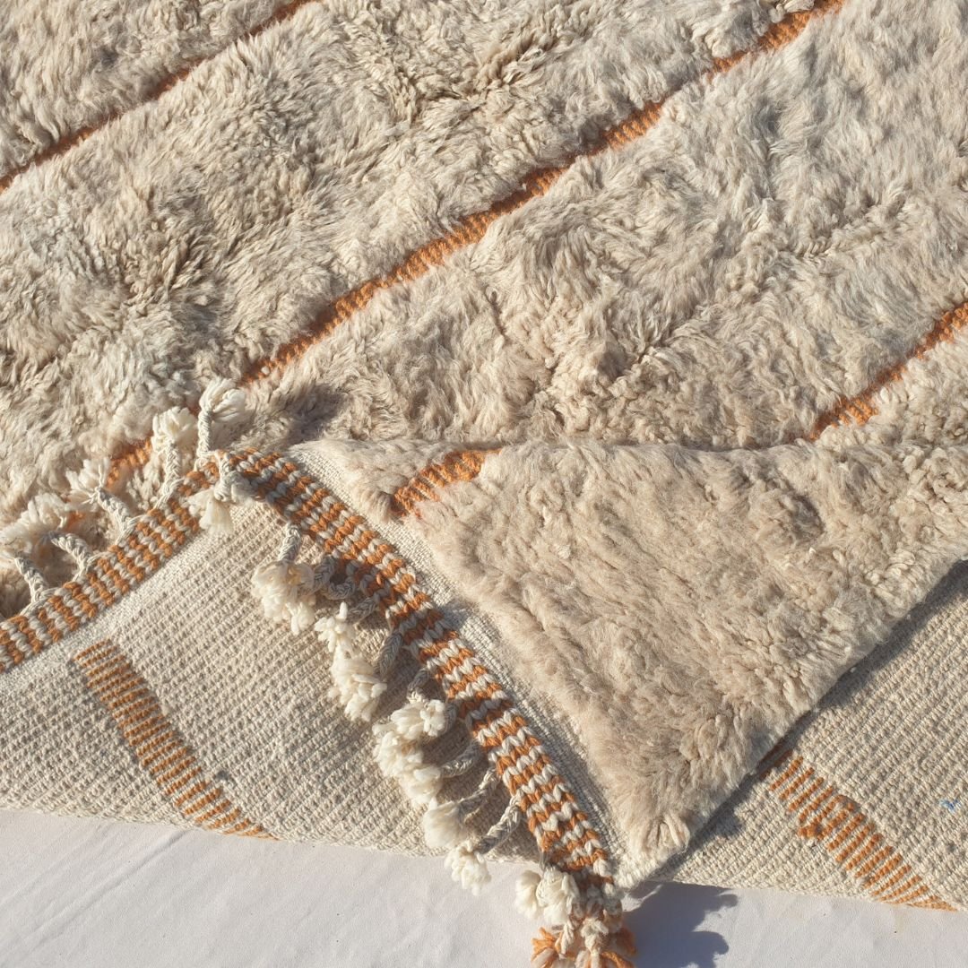 Handwoven fringes and thick plush edge of 6x9 high-quality Beni Ourain Moroccan rug