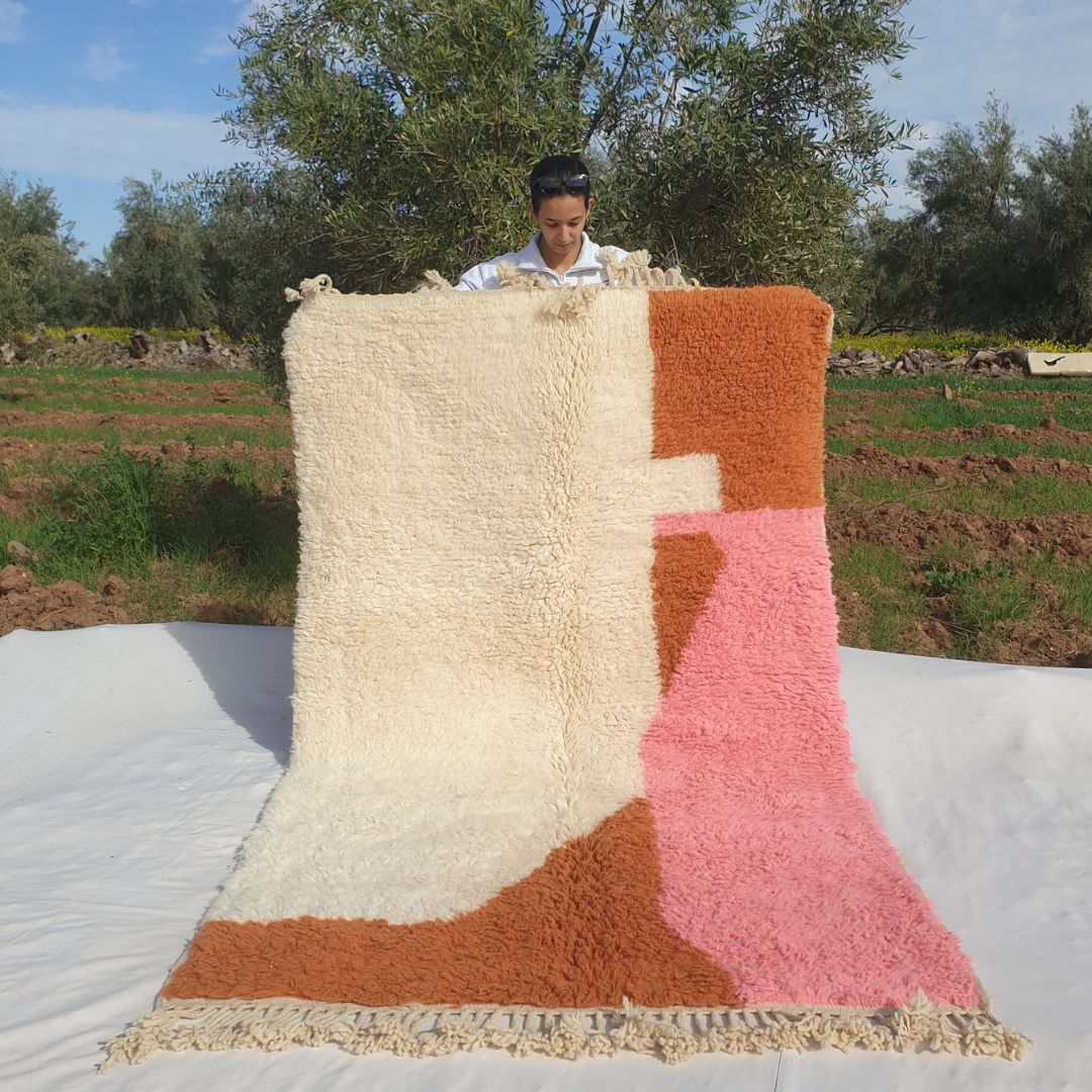 Super soft 5x8 Beni Ourain Moroccan rug in ivory with pink & orange abstract blocks ultra thick fluffy pile held outdoors