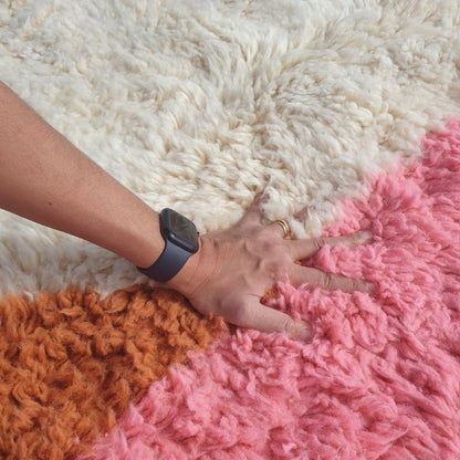 Ultra fluffy thick high-pile wool texture detail of ivory Beni Ourain plush shag rug