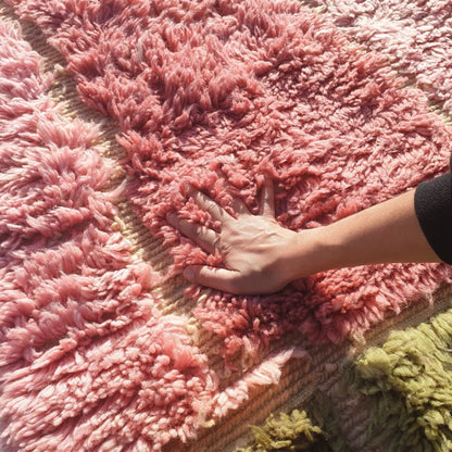 Close-up of dense ultra-plush shag pile and soft natural wool texture on handmade Beni Mrirt olive green and pink runner