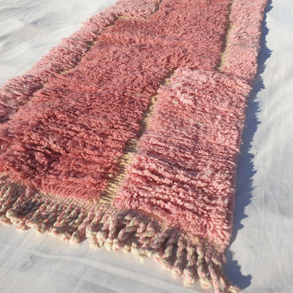 Detailed abstract wavy pattern with rich olive green upper section flowing into soft pastel pink lower half on this fluffy Moroccan hallway rug