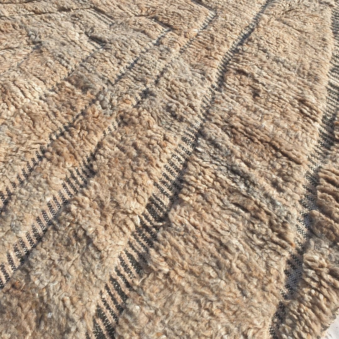 Ultra soft fluffy high-pile wool texture detail of cream Beni Ourain plush shag rug