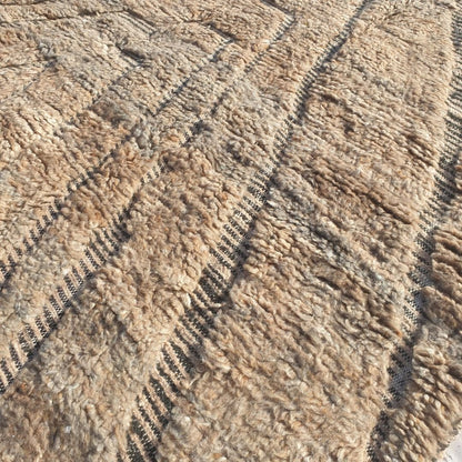 Ultra soft fluffy high-pile wool texture detail of cream Beni Ourain plush shag rug