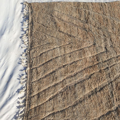 Classic geometric lines and chevron pattern in dark tones on neutral ivory field of authentic Beni Ourain Moroccan wool rug