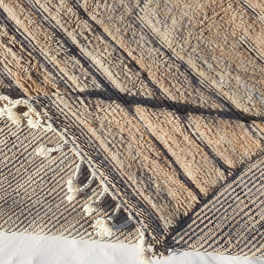 Handwoven fringes and thick plush edge of 7x11 high-quality Beni Ourain Moroccan rug