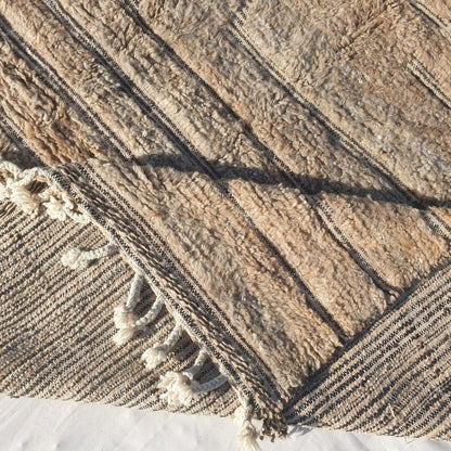 Handwoven fringes and thick plush edge of 7x11 high-quality Beni Ourain Moroccan rug