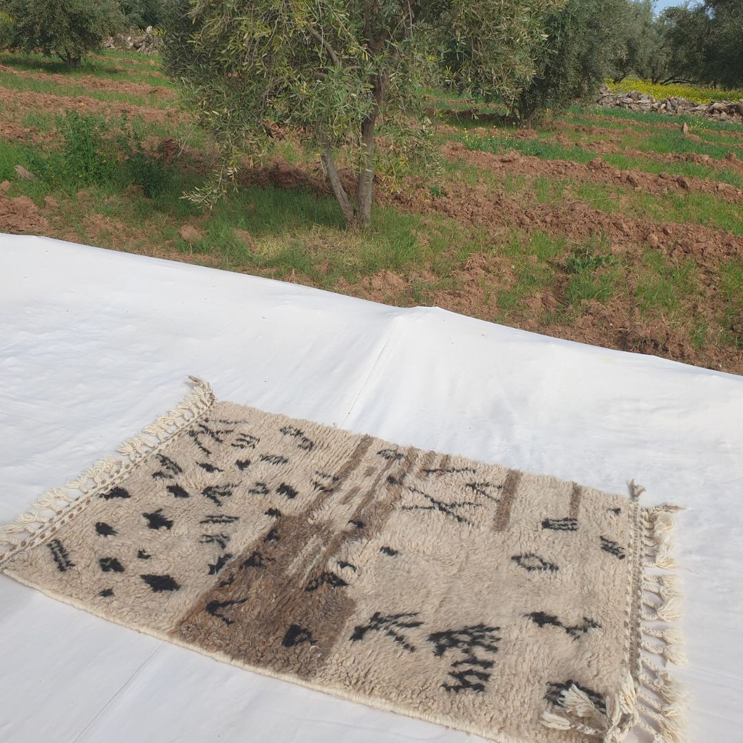 Nama | 3x5 Beni Ourain Rug - Soft Beige Moroccan Shag Rug with Black Geometric Symbols | 3'8"x5'3" Ft | 112x160 cm - OunizZ