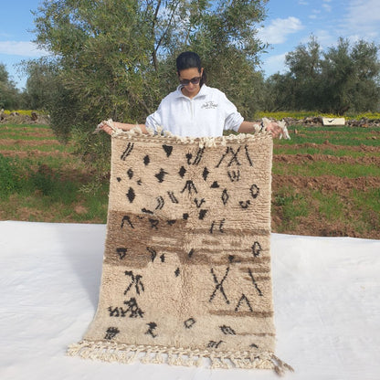 Super soft 3x5 Beni Ourain Moroccan rug with bold black geometric symbols ultra thick fluffy pile held outdoors