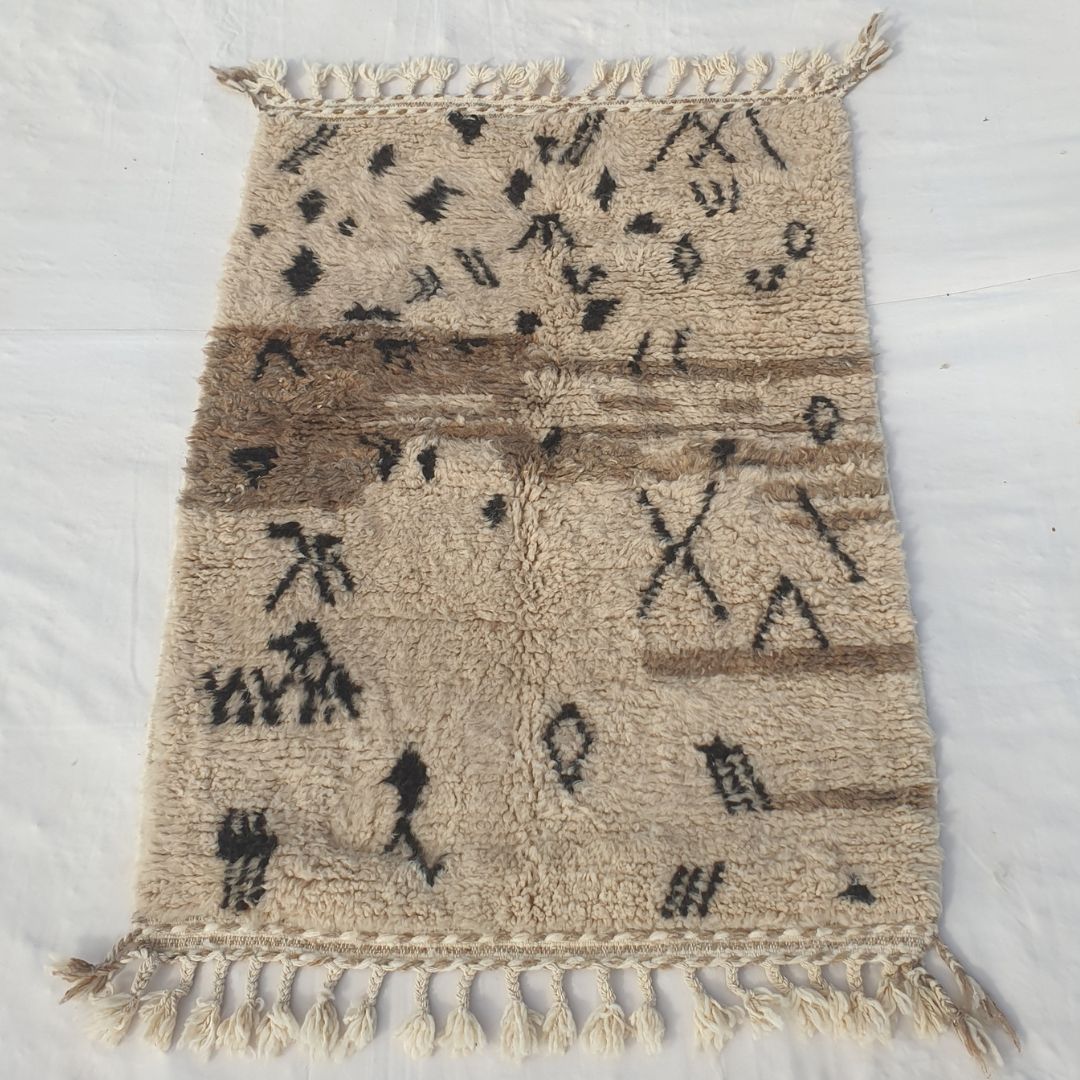 Dense plush pile and classic black Berber contrast in this sumptuous Beni Ourain carpet