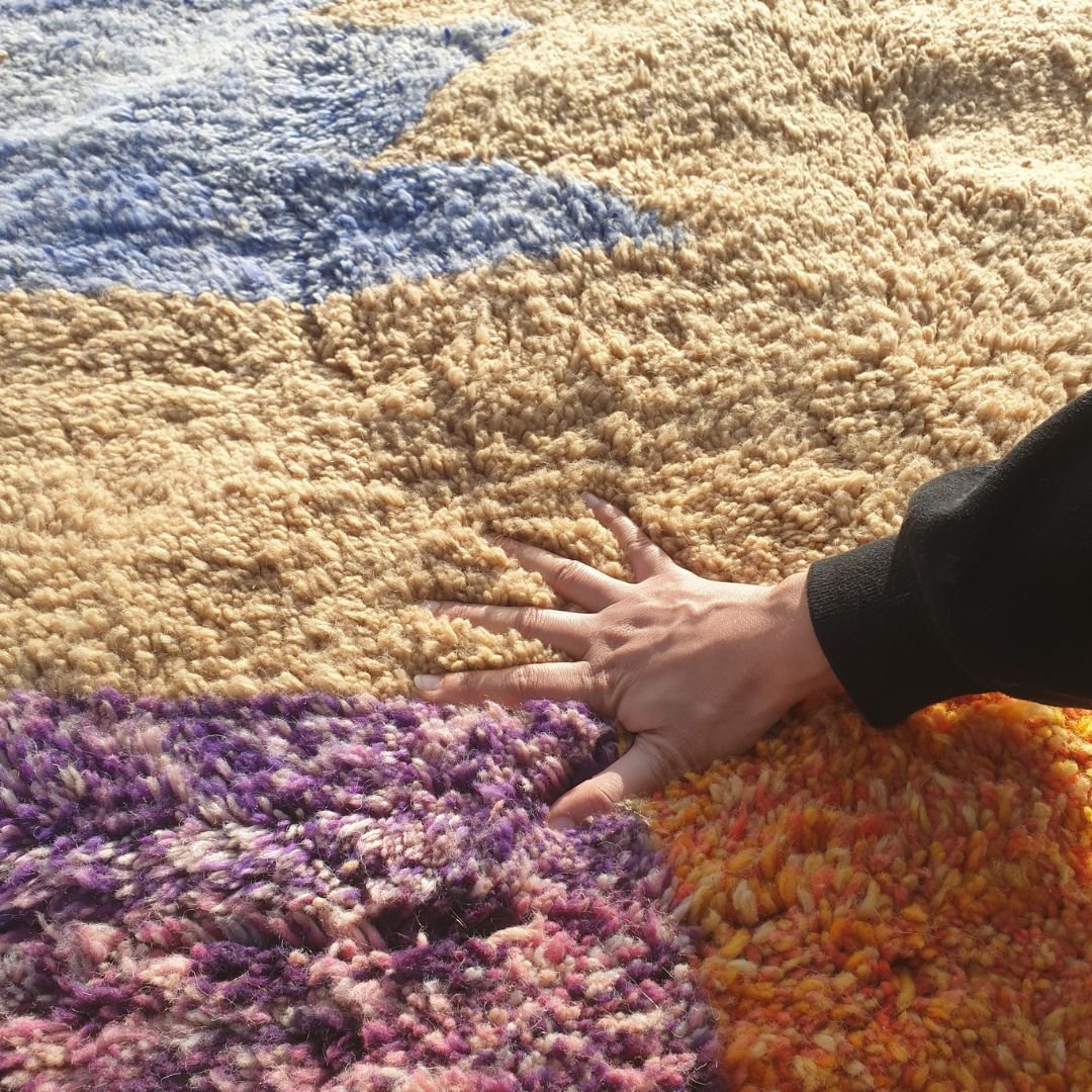 Close-up of ultra-plush thick shag pile and soft natural wool texture on handmade Beni Mrirt luxury rug