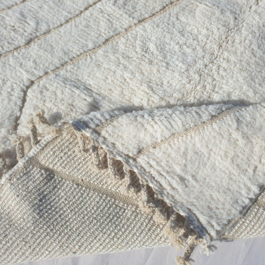 Handwoven fringes and thick ultra fluffy edge of 5x8 high-quality Beni Ourain Moroccan rug