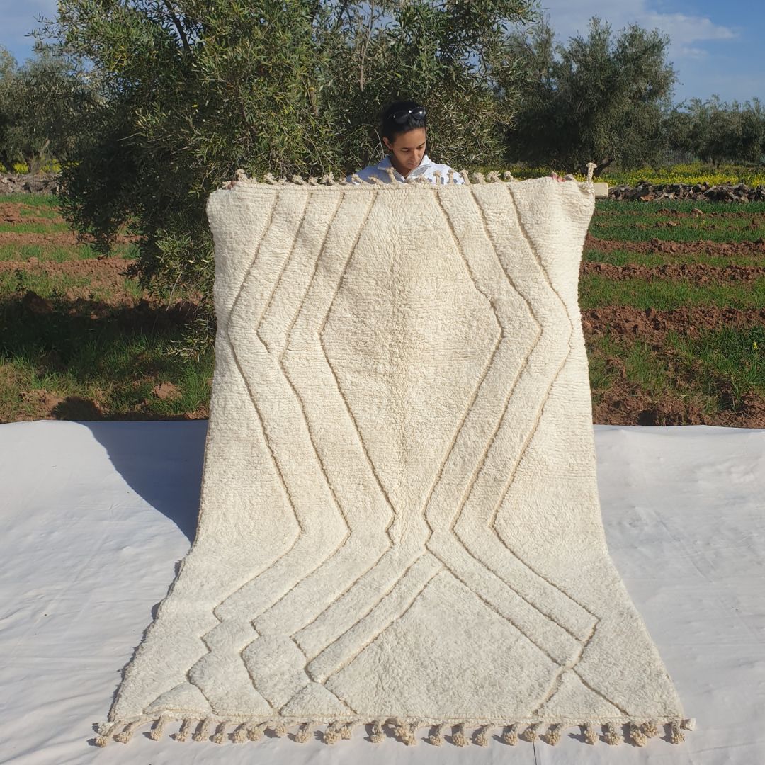 Super soft 5x8 Beni Ourain Moroccan rug in white with beige chevron zigzag V motifs ultra thick fluffy pile held outdoors