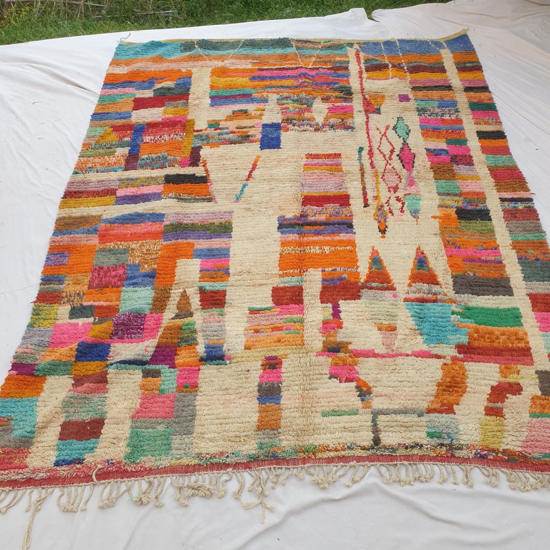 Authentic Boujad Moroccan rug 311×380 cm laid flat — cream ivory background structured into a patchwork mosaic by vertical cream bands alternating with dense horizontal multicolor stripes in orange, teal, red, pink, blue, yellow and green, handmade in Morocco by Berber women