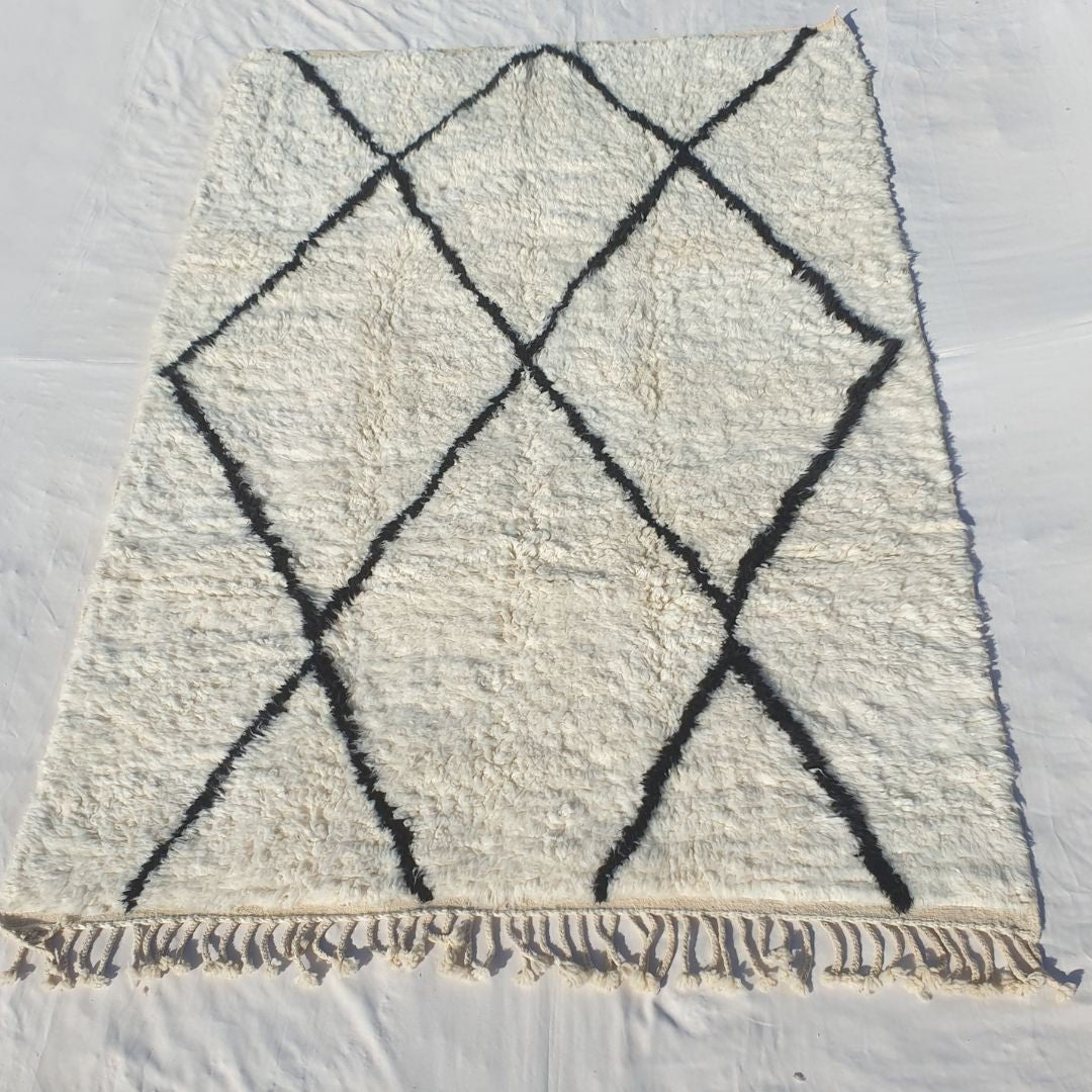 Dense plush pile and striking black diamonds in this sumptuous Beni Ourain Berber carpet