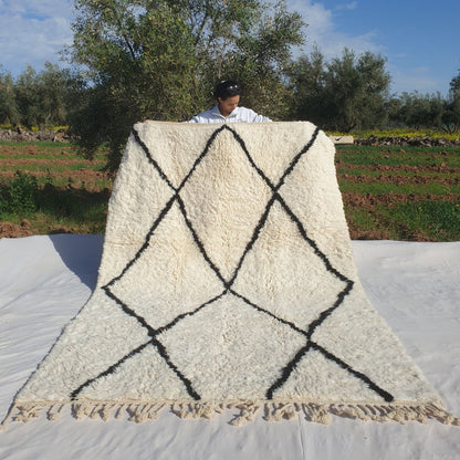Super soft 6x9 Beni Ourain Moroccan rug in pure white with bold black diamond lattice ultra thick fluffy pile held outdoors