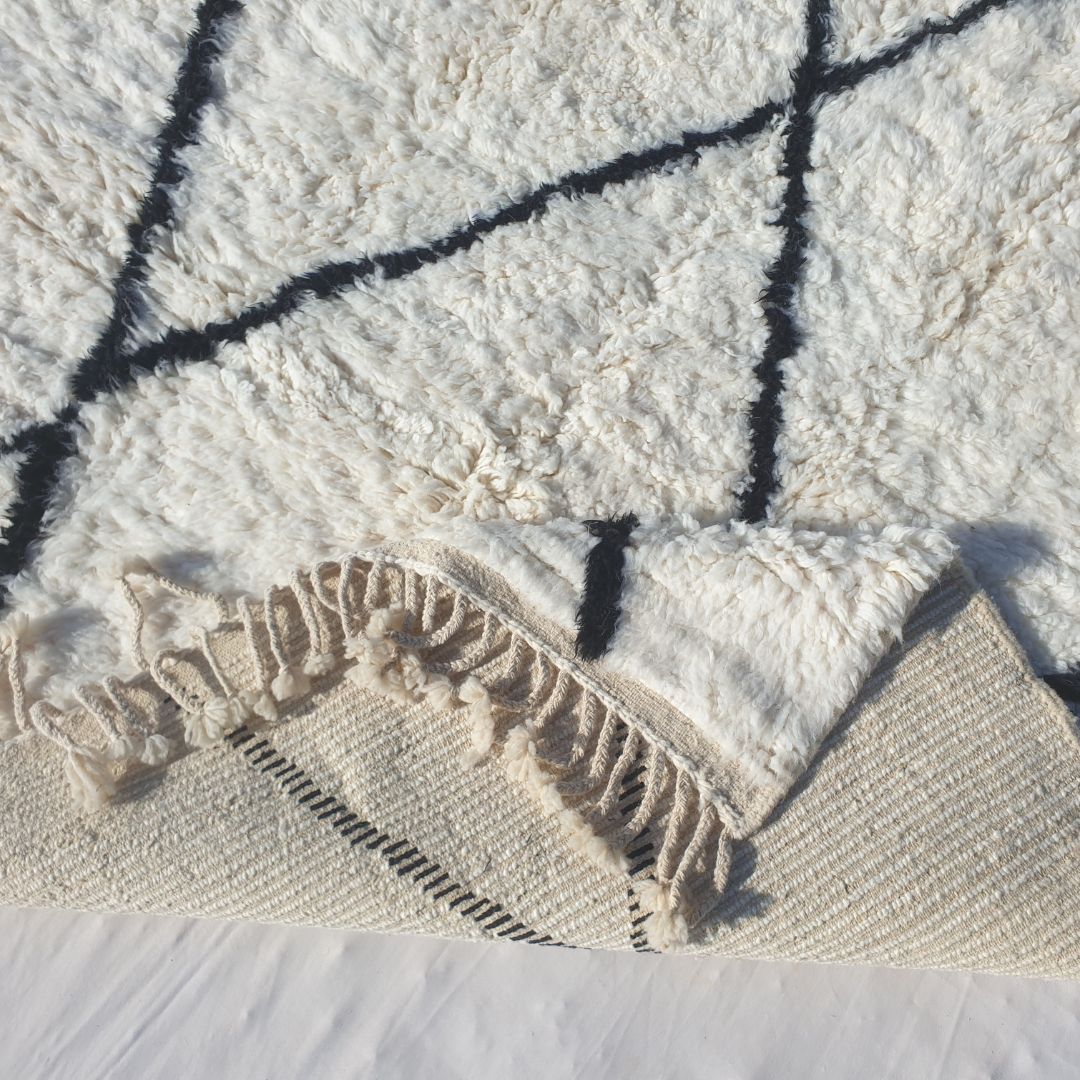 Handwoven fringes and thick ultra fluffy edge of 6x9 high-quality Beni Ourain Moroccan rug