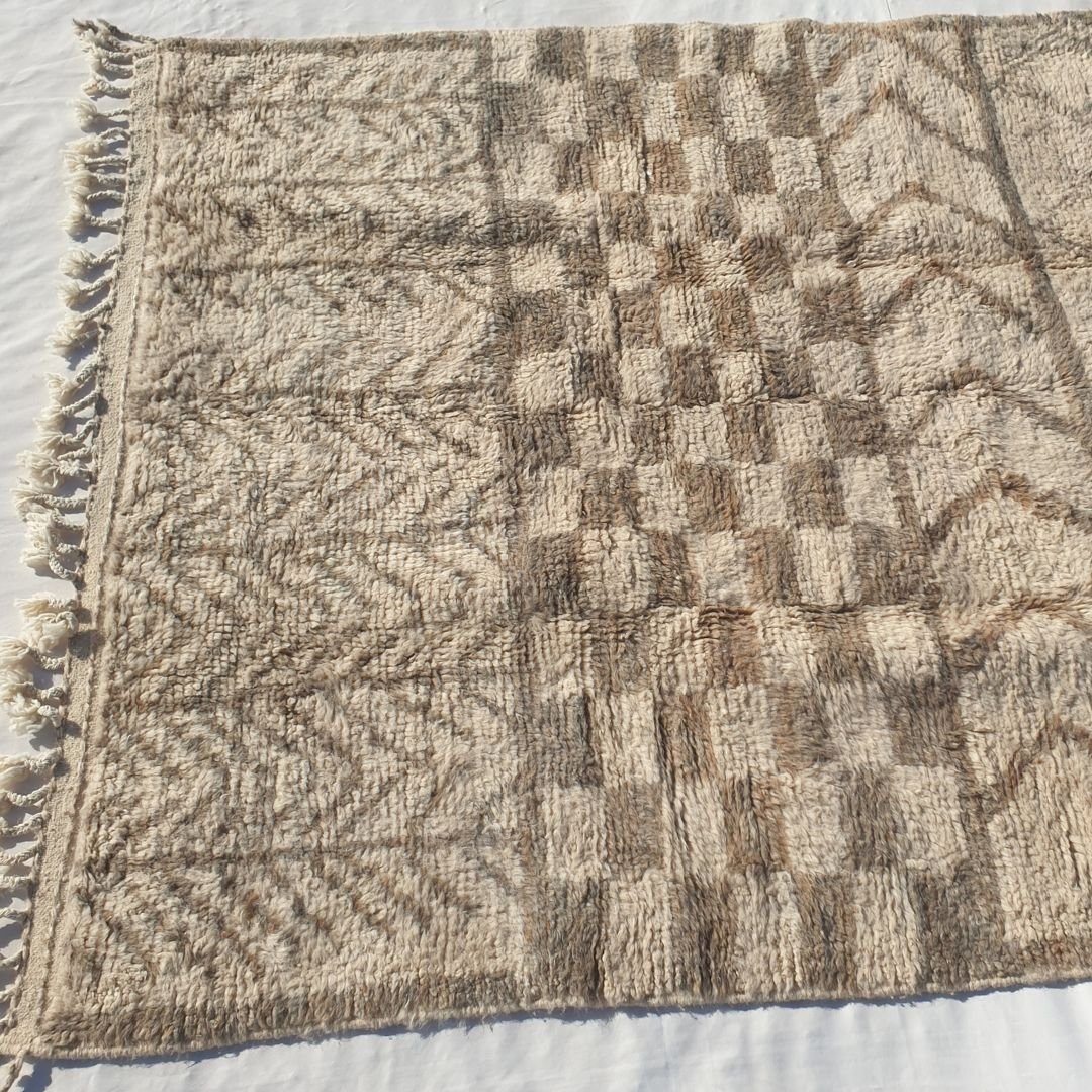 Repeating beige taupe chevron V/zigzag patterns on ivory field of authentic Beni Ourain Moroccan wool rug