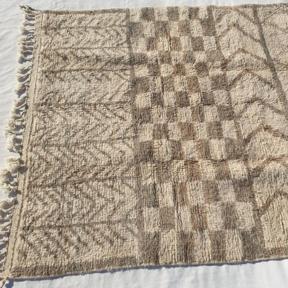 Repeating beige taupe chevron V/zigzag patterns on ivory field of authentic Beni Ourain Moroccan wool rug