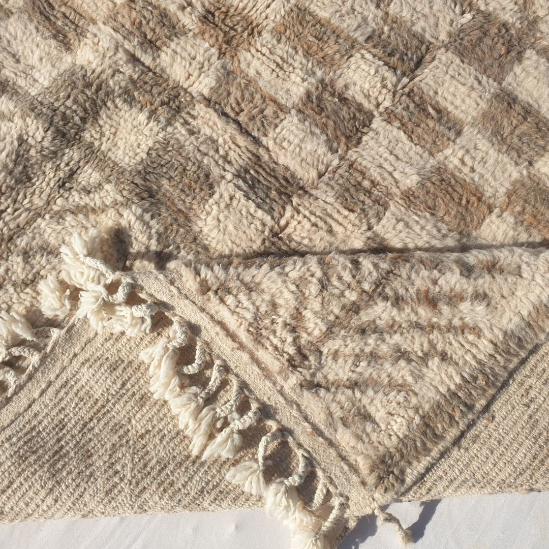 Handwoven fringes and thick plush edge of 6x9 high-quality Beni Ourain Moroccan rug
